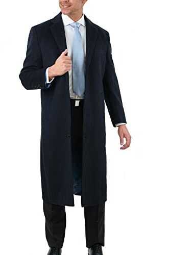 Man wearing a long dark coat and light blue tie