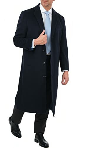 Man wearing a black overcoat with a light blue tie